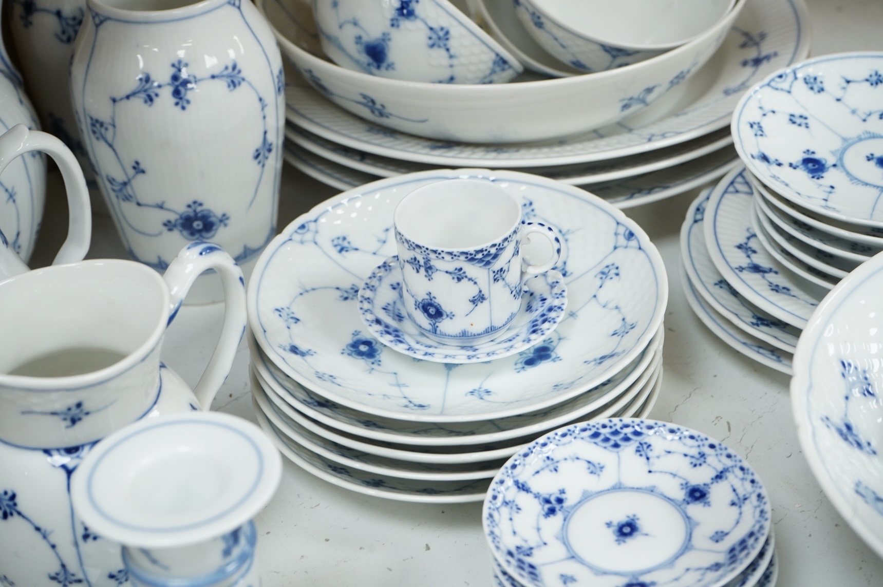 A collection of Royal Copenhagen and Bing & Grondahl onion pattern blue and white tableware